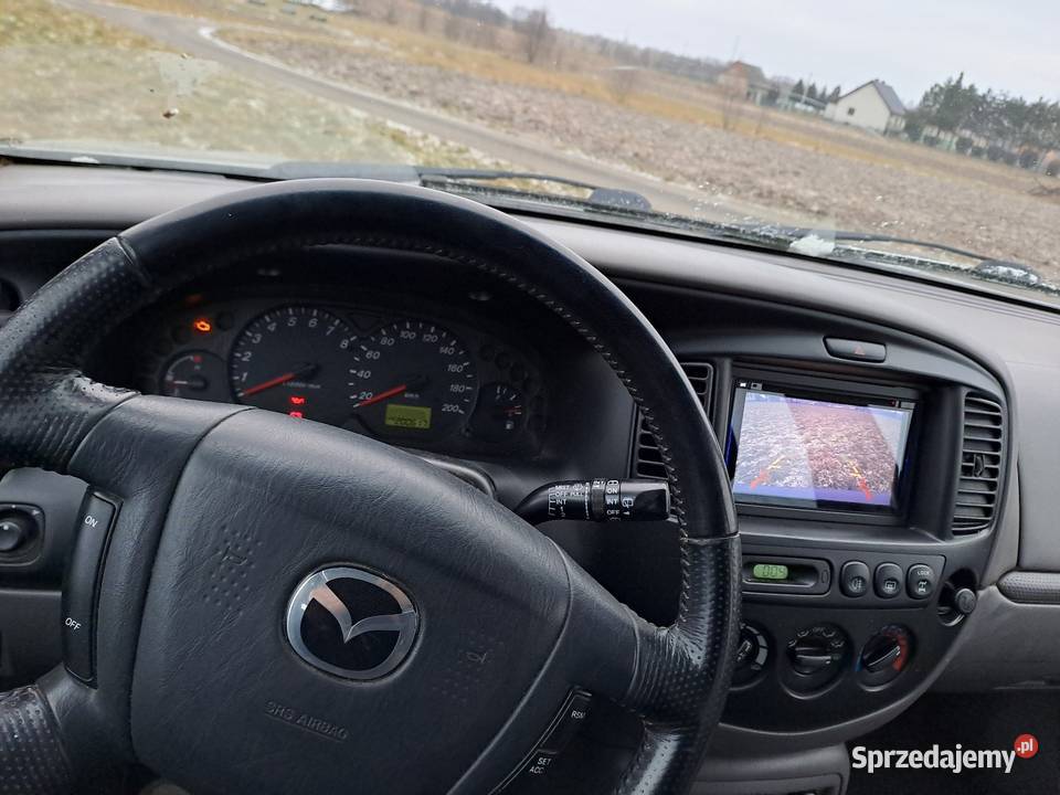 Mazda Tribute 44 welurowa tapicerka