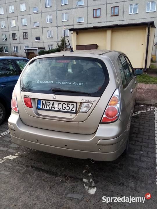 Suzuki Liana chatchback beżowy metal 16 Benzyna Liana Pionki