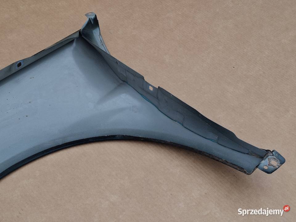 MERCEDES BKLASA W245 BŁOTNIK PRAWY PRZÓD osobowe Błotniki Bieleń