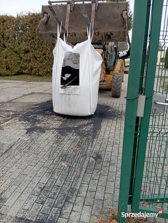 Usługi koparkoładowarką Cat 428D Pustków