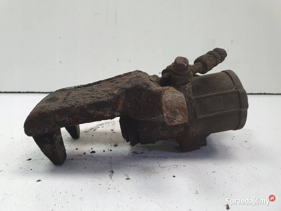 Volvo S60II XC60 TYLNY ZACISK HAMULCOWY LEWY tył osobowe Części samochodowe Janów