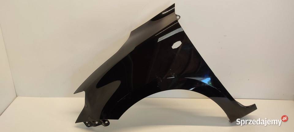 SUZUKI SWIFT MK8 BŁOTNIK LEWY PRZÓD