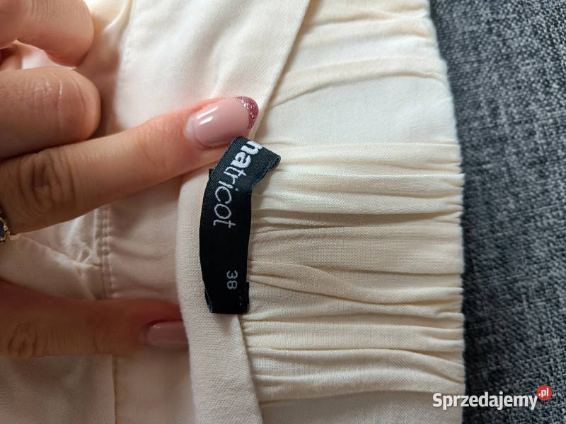 Kremowe beżowe luźne spodenki z kieszeniami r S Dąbrowica
