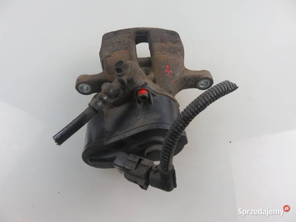 ZACISK LEWY TYŁ VW PASSAT B7 20 TDI