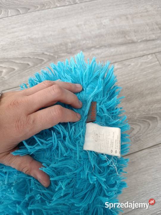 pluszowa poduszka która przypomina postać z Poznań