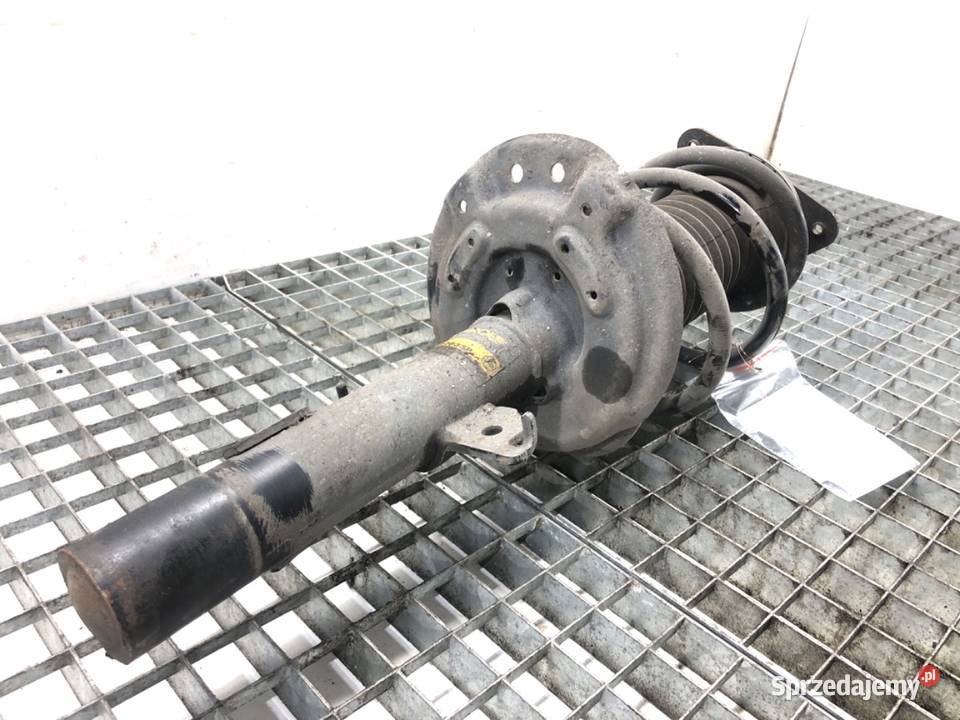 AMORTYZATOR LEWY PRZÓD ZE SPRĘŻYNĄ RENAULT