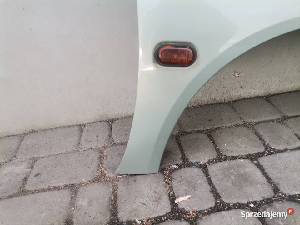 RENAULT MEGANE 1 FL BŁOTNIK PRAWY PRZEDNI MV931 Nowy Sącz