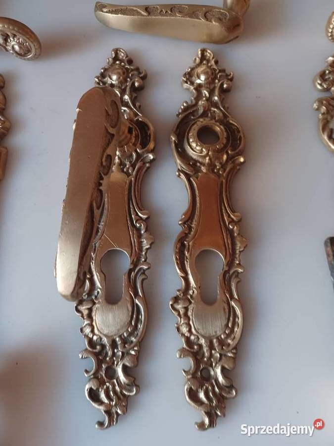 Komplet klamek i szyldów Mosiądz Poznań