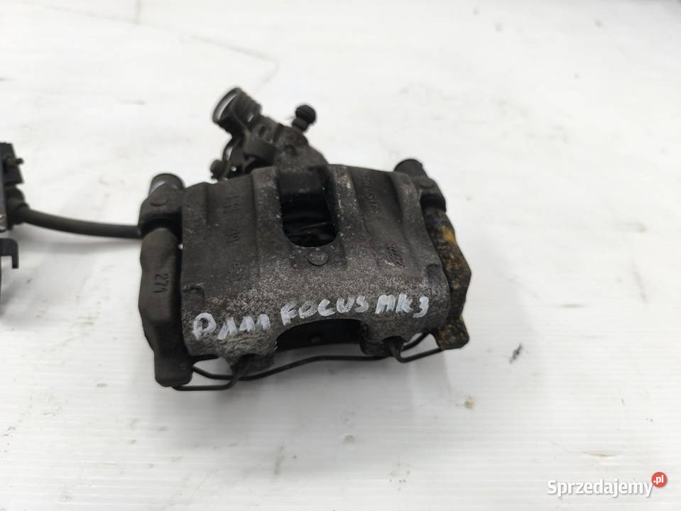 ZACISK LEWY TYŁ FORD FOCUS MK3 LIFT KOMBI