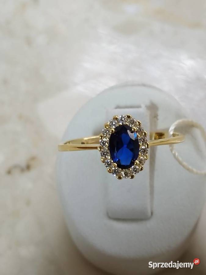 Złoty Nowy pierścionek z oczkiem koloru szafir i