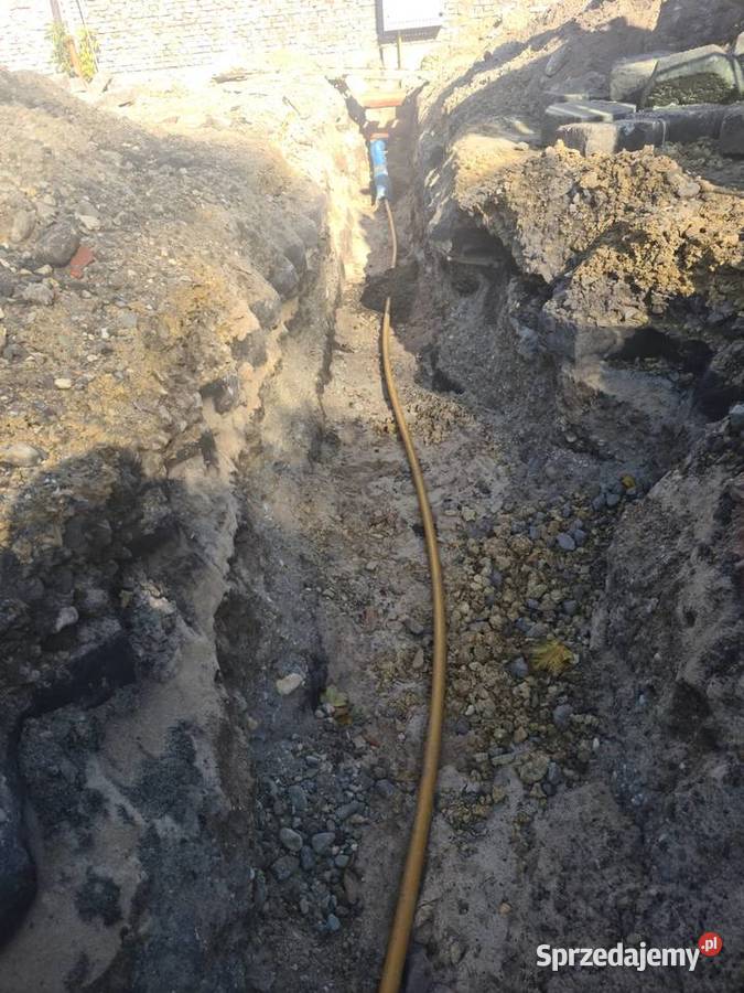 Minikoparka z młotem wyburzeniowym usługi