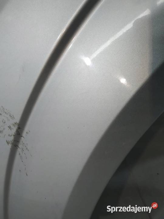 BŁOTNIK B LEWY PRZÓD SREBRNY Z157 Opel Zafira II