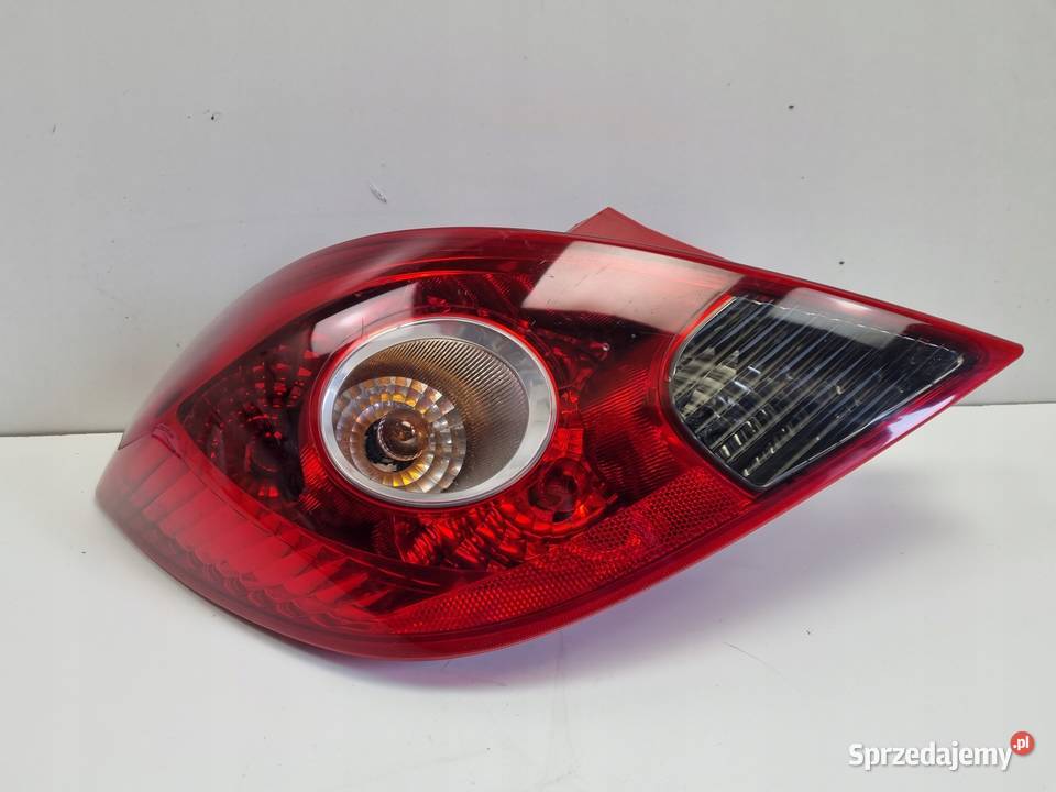 Opel Corsa D HTB 5D 0611r TYLNIA TYLNA LAMPA Rudka