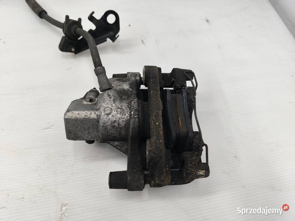 ZACISK LEWY TYŁ FORD FOCUS MK3 LIFT KOMBI