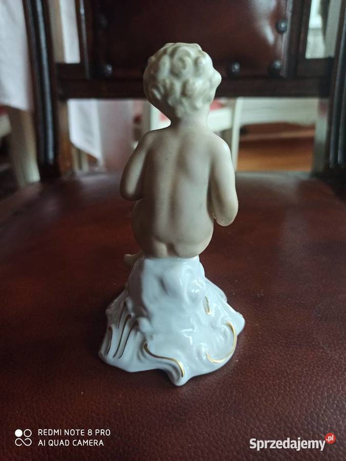 Figurka Puto z harmoszką Sygnatura Schaubach Porcelana i szkło pomorskie Gdańsk