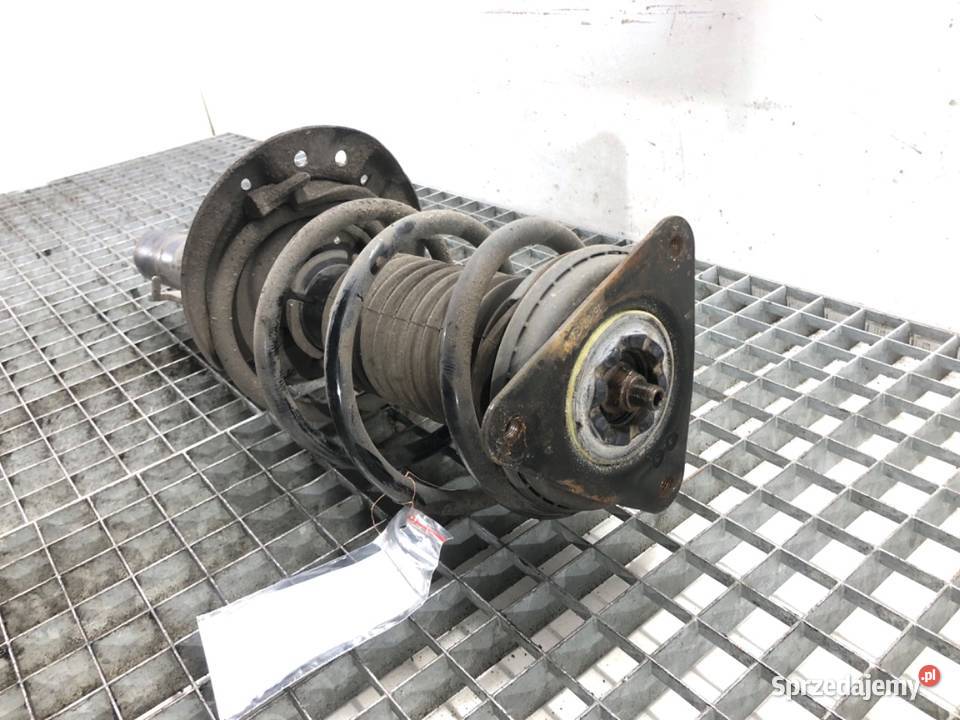 AMORTYZATOR LEWY PRZÓD ZE SPRĘŻYNĄ RENAULT osobowe