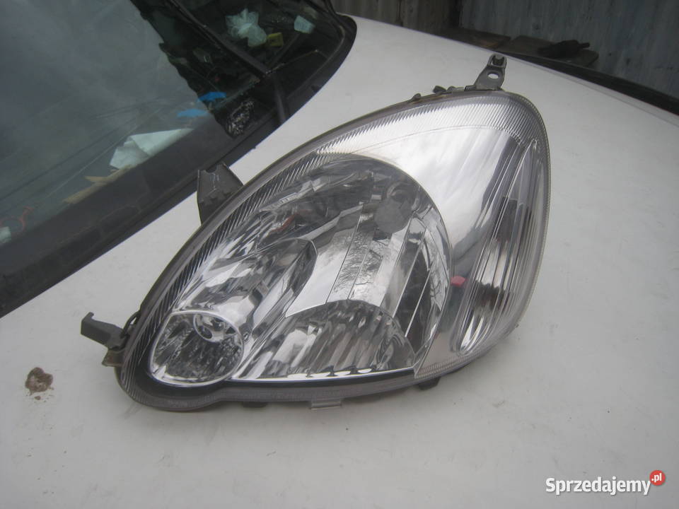 Lampa przednia lewa TYC Toyota Yaris I lift 0306