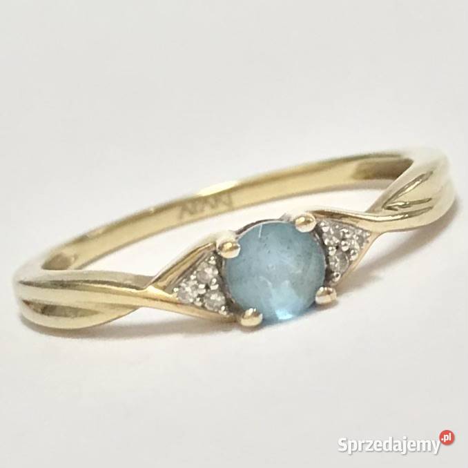 Złoty pierścionek 9K 375 z błękitnym topazem i Warszawa sprzedam