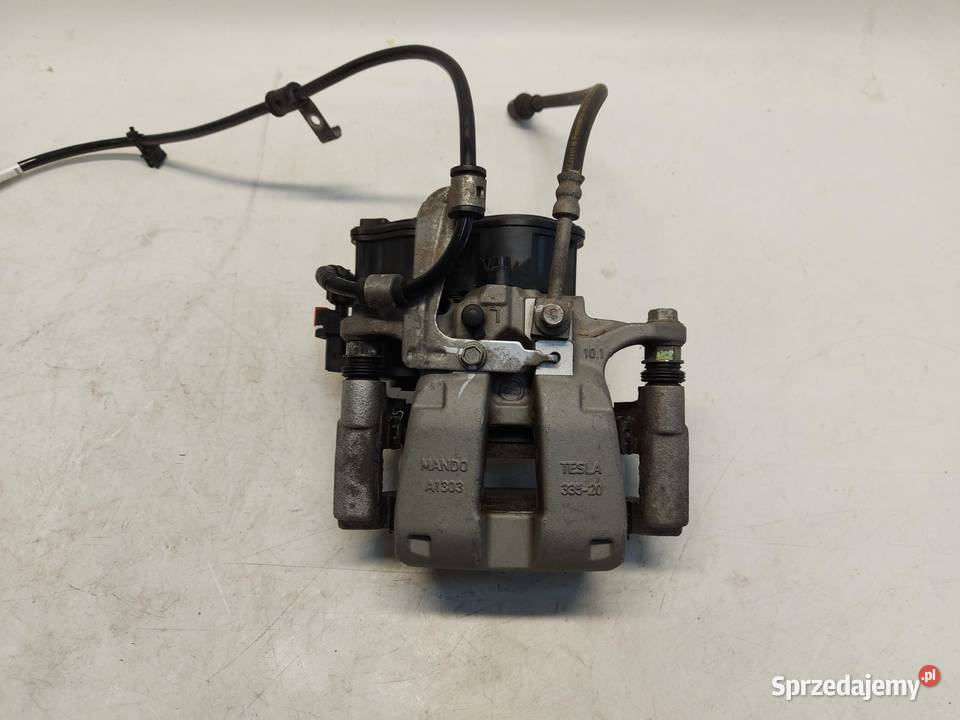 TESLA MODEL Y 2023r Zacisk hamulcowy tył lewy