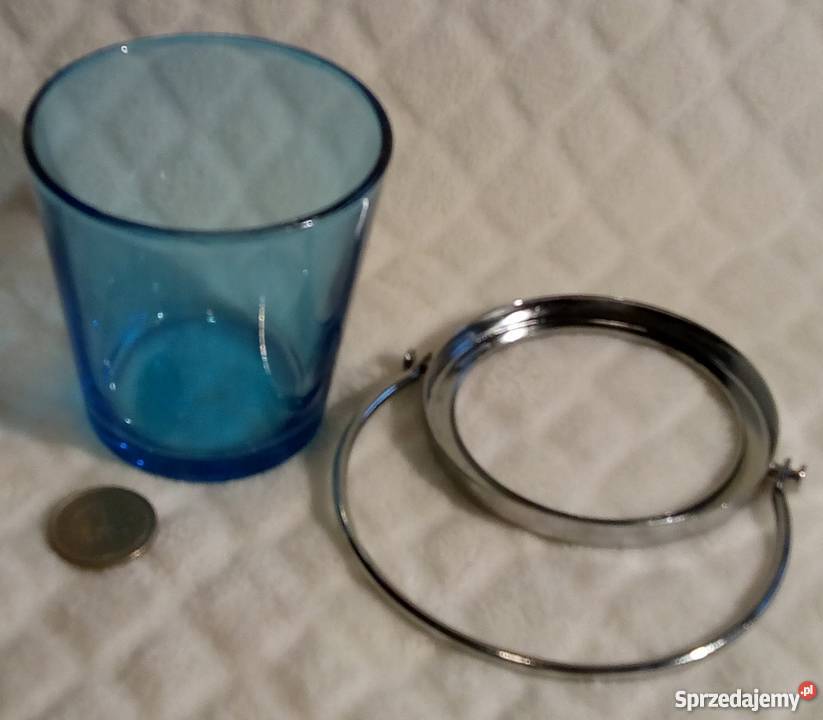 Niebieskawy szklany świecznik z metalową opaską Rogoźnik