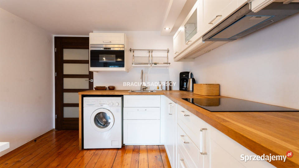 sprzedaży mieszkania Kraków Moniuszki 14673m2 12948zł/m2