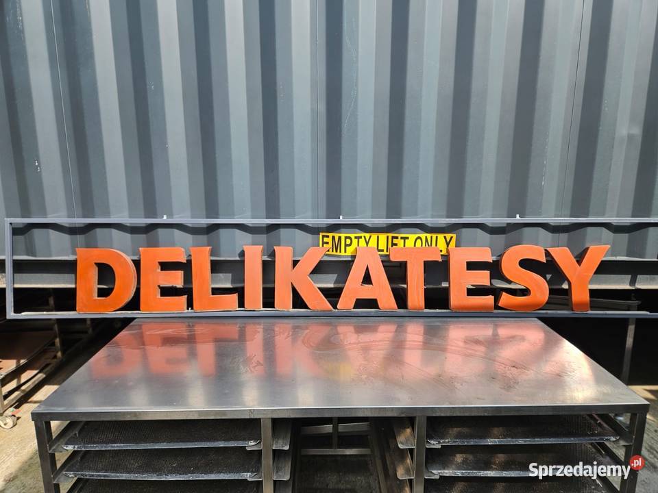 Baner SZYLD reklamowy 300x40 DELIKATESY Pszczyna