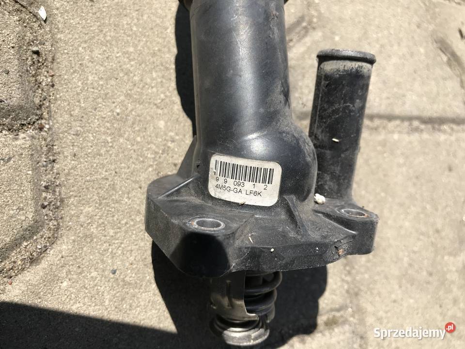 FORD OBUDOWA TERMOSTATU TERMOSTAT 4M5GGA LF6K