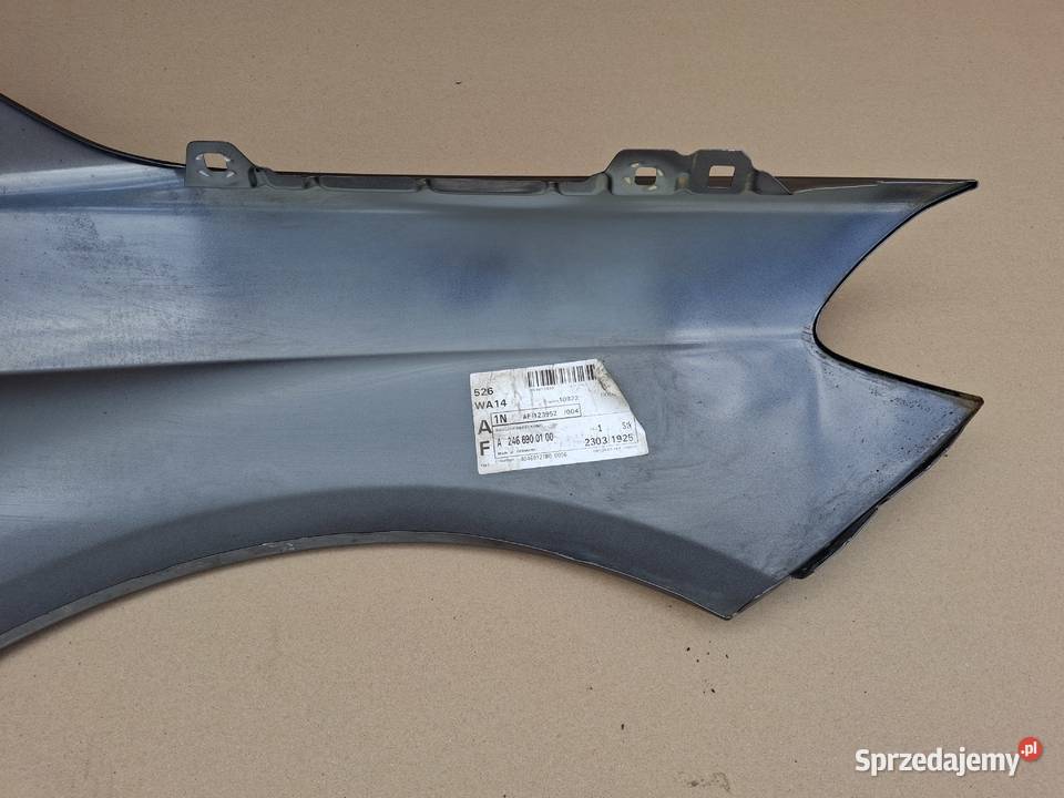 MERCEDES BKLASA W246 BŁOTNIK LEWY PRZÓD Bieleń