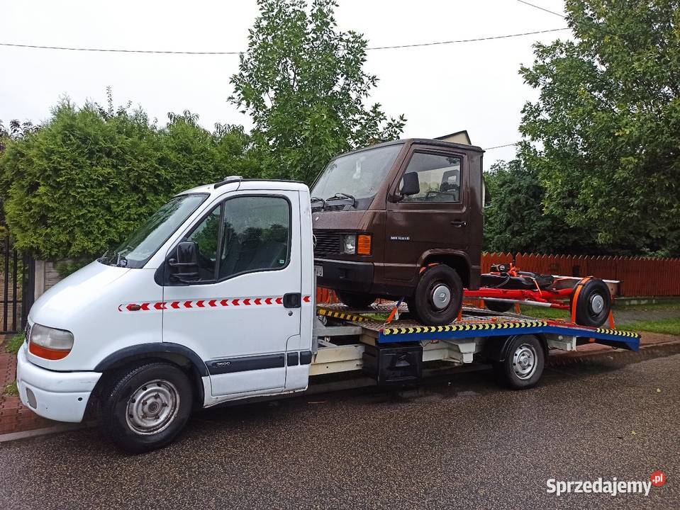Laweta transport pojazdów maszyn rolniczych Usługi Woźniki