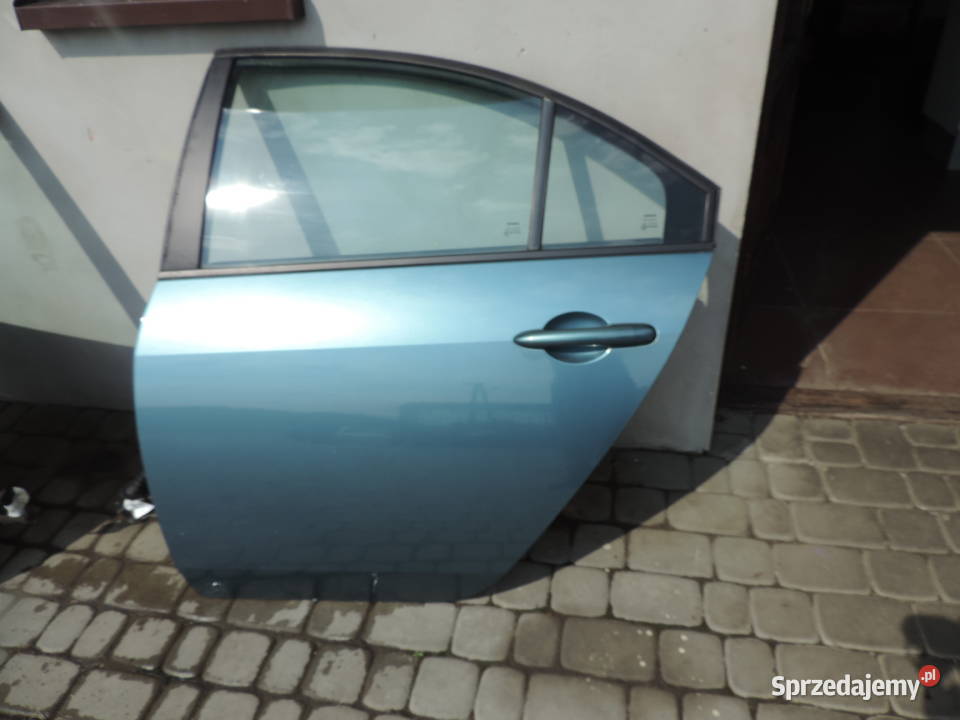 NISSAN PRIMERA P12 SEDAN DRZWI LEWY TYŁ BY4G Motoryzacja Nowy Sącz