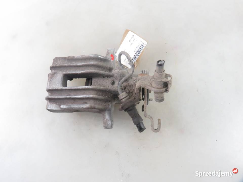 ZACISK LEWY TYŁ VW GOLF V 1K1 16 FSI BAG