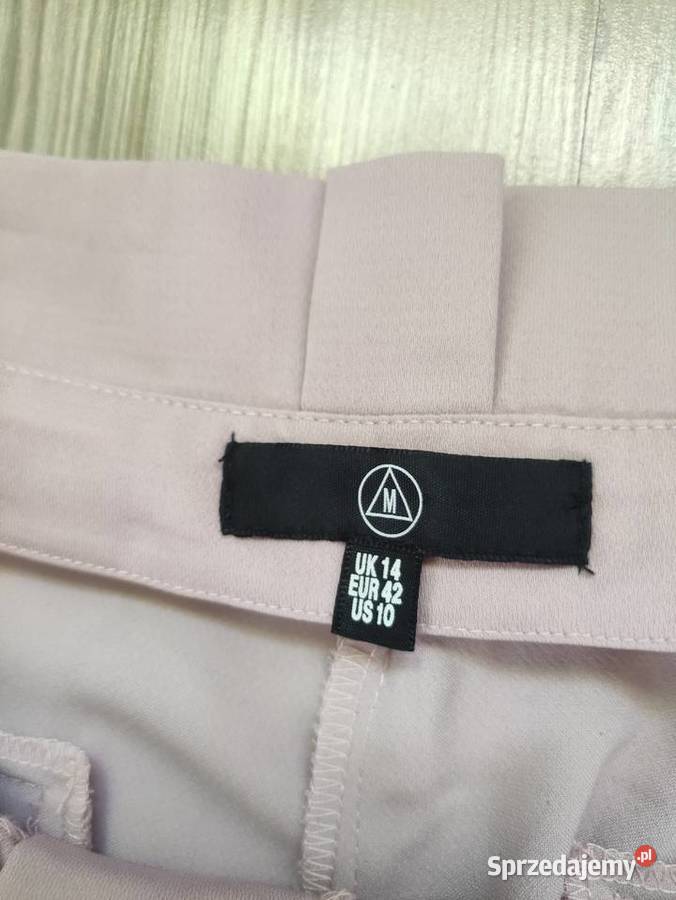 Spodnie pudrowy róż Missguided rozmiar 42 Długie Spodnie Jawiszowice