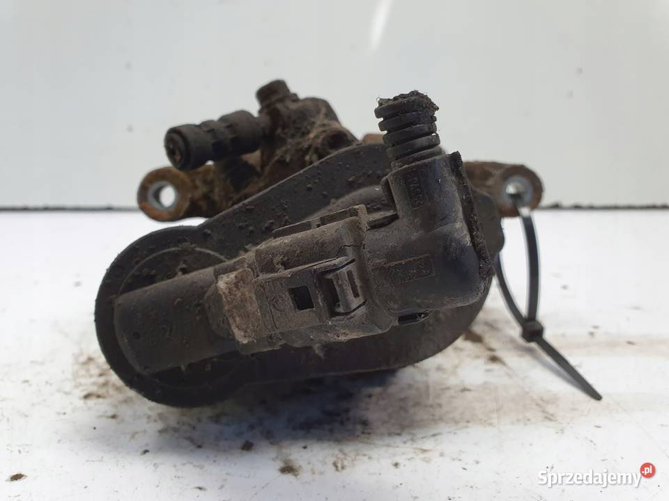 VW Passat B6 TYLNY ZACISK HAMULCOWY lewy tył