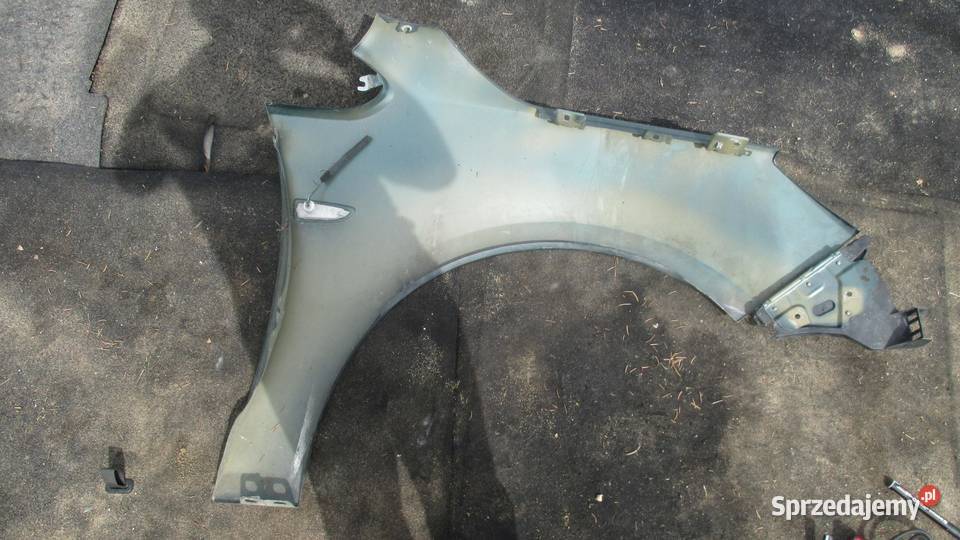 OPEL ASTRA J IV 10r błotnik lewy przód