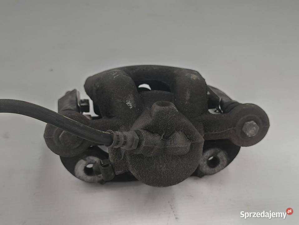 ZACISK LEWY TYŁ BMW 1 E87 E81 LIFT 16 Części samochodowe wielkopolskie