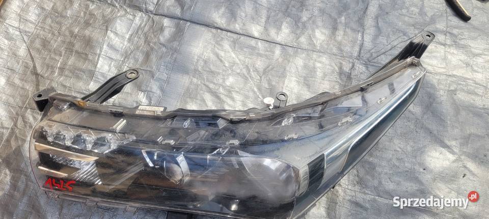 REFLEKTOR LAMPA LEWY PRZÓD TOYOTA COROLLA E16 osobowe Ruda Śląska