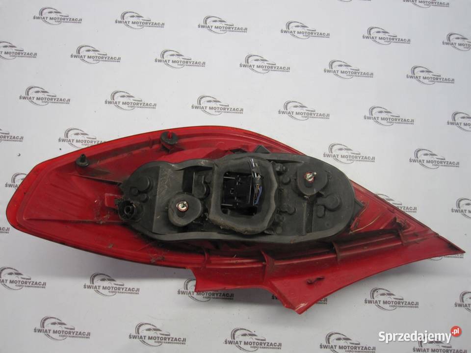 OPEL CORSA D lampa lewa tył 13211840 89038962A