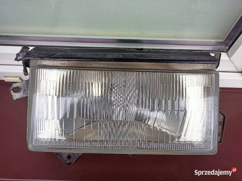 Nissan Sunny B11 lampa przednia prawa reflektor osobowe Sieradz