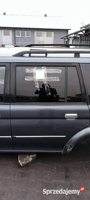 DRZWI LEWE TYŁ MITSHUBISHI MONTERO