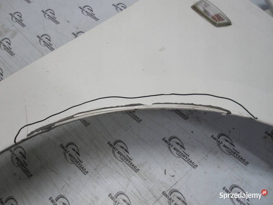 OPEL CORSA E 17r błotnik prawy przód