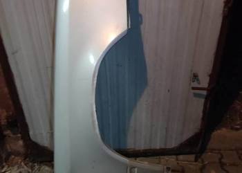 Oryginalny prawy przedni  błotnik W124 C124