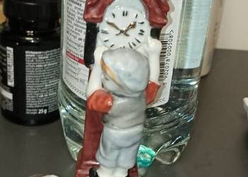 Figurka ceramiczna dzieci z zegarem