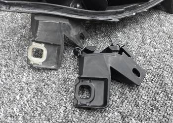 Uchwyt dolny reflektora reperaturka mocowania lampy Fiat Bravo II NOWE