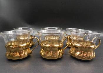 Szklanki Schott Mainz,z przezroczystego szkła Jena i metalowe koszyczki 6sz