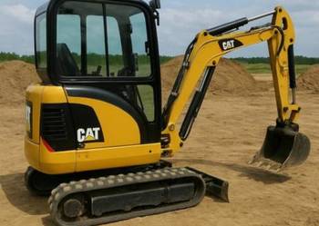 Wynajem minikoparki Cat z operatorem lub bez