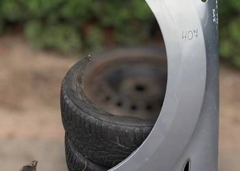 Błotnik Ford Mondeo MK4 Lewy kolor nieznany części Czarna Opona