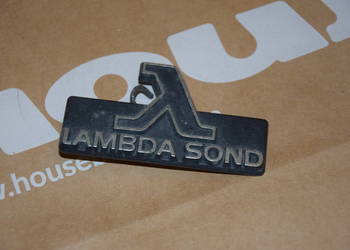 Emblemat LAMBDA SOND w grill Volvo 740 940 960, oryginał