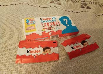 Pudełko i puste papierki po kinder czekoladkach ze znakiem zapytania