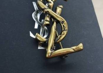 Używana broszka YSL Saint Laurent Paris w kolorze złotym