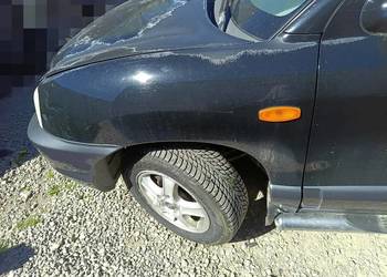 Błotnik błotniki lewy prawy Hyundai Santa Fe I